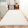 Rabbit fur rug is soft, thick, non-slip, waterproof, machine washable, perfect for living room and bedroom.
