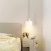 S68deadf311c44f4ea9a0ff692a064d2cq.webp Nordic Modern Glass Bedroom Bedside Long Line Small Chandelier Restaurant Bar